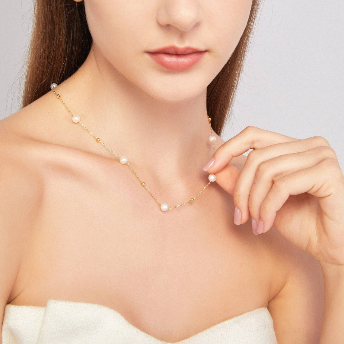 Gold and pearl necklace - alternating pearls and gold chain
