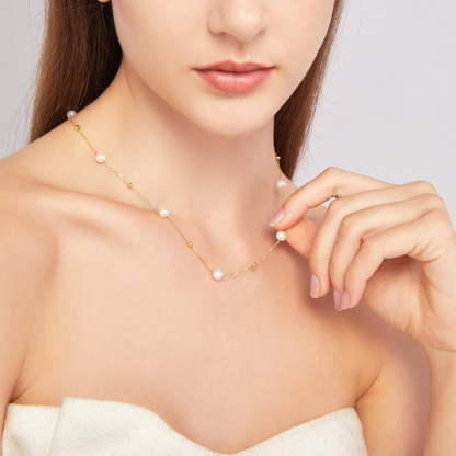 Gold and pearl necklace - alternating pearls and gold chain