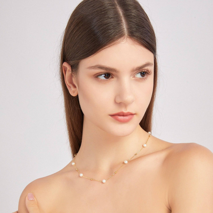 Gold and pearl necklace - alternating pearls and gold chain